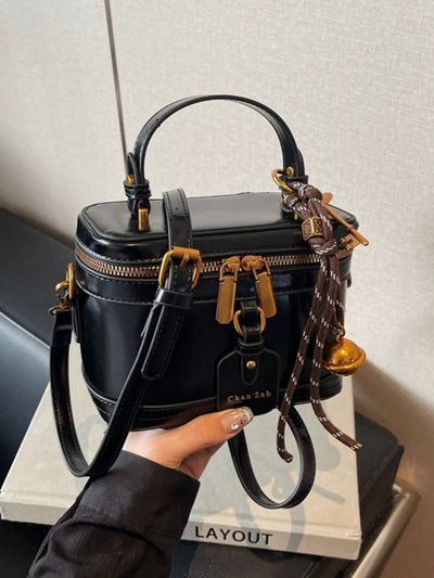Bolso cruzado rígido