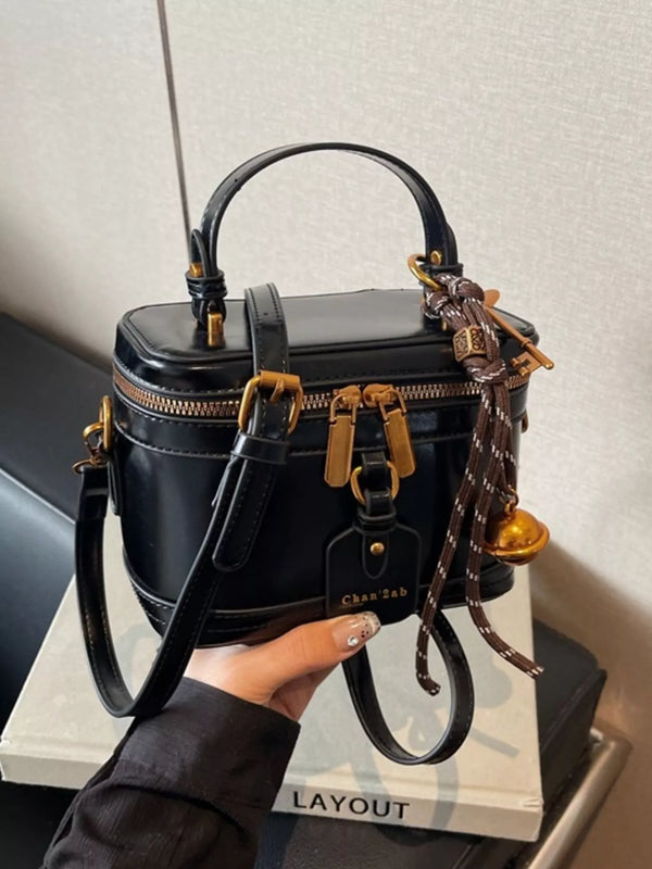 Bolso cruzado rígido
